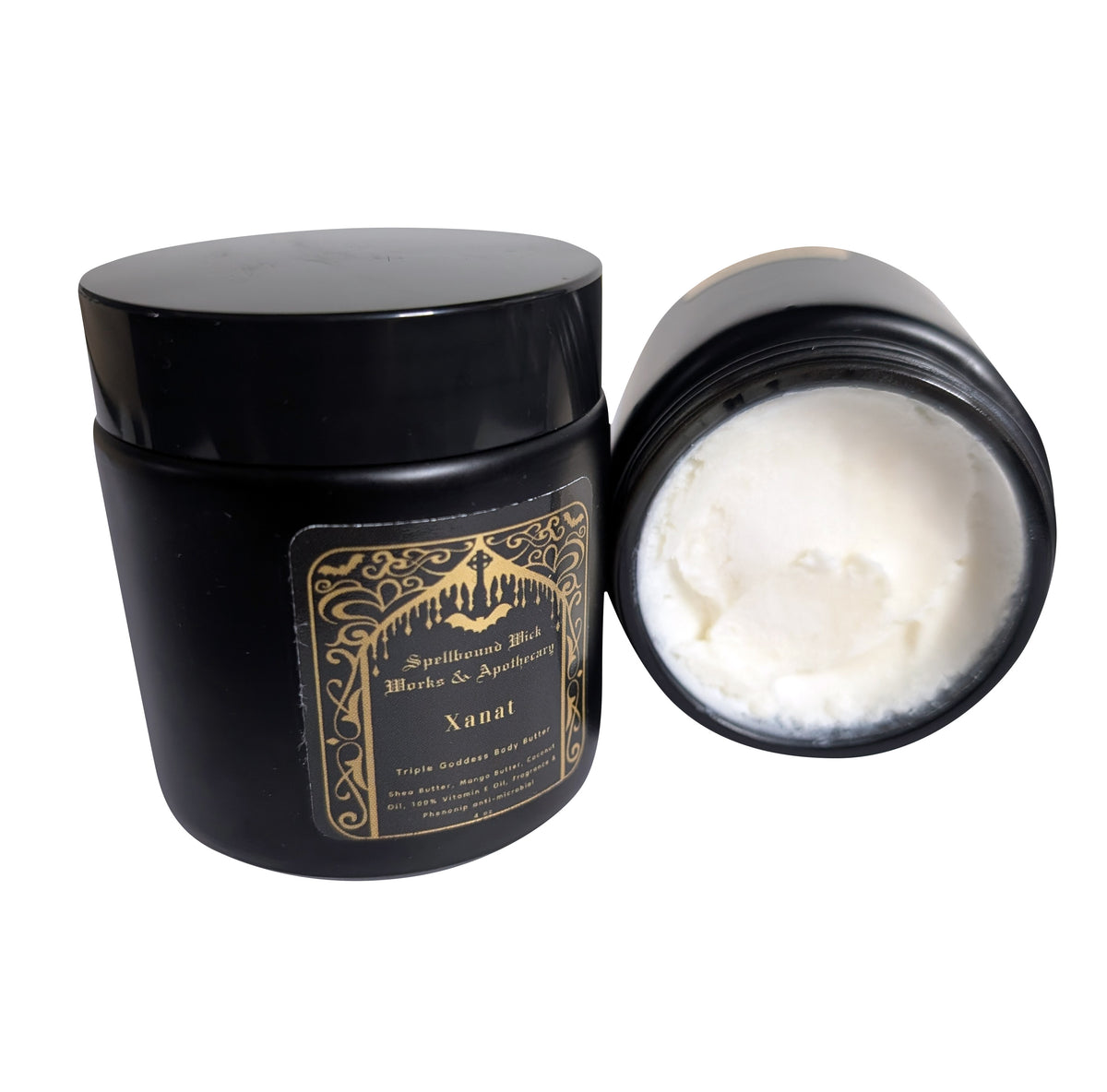 Open black jar of whipped white body butter with the black lid resting behind it on a white background.