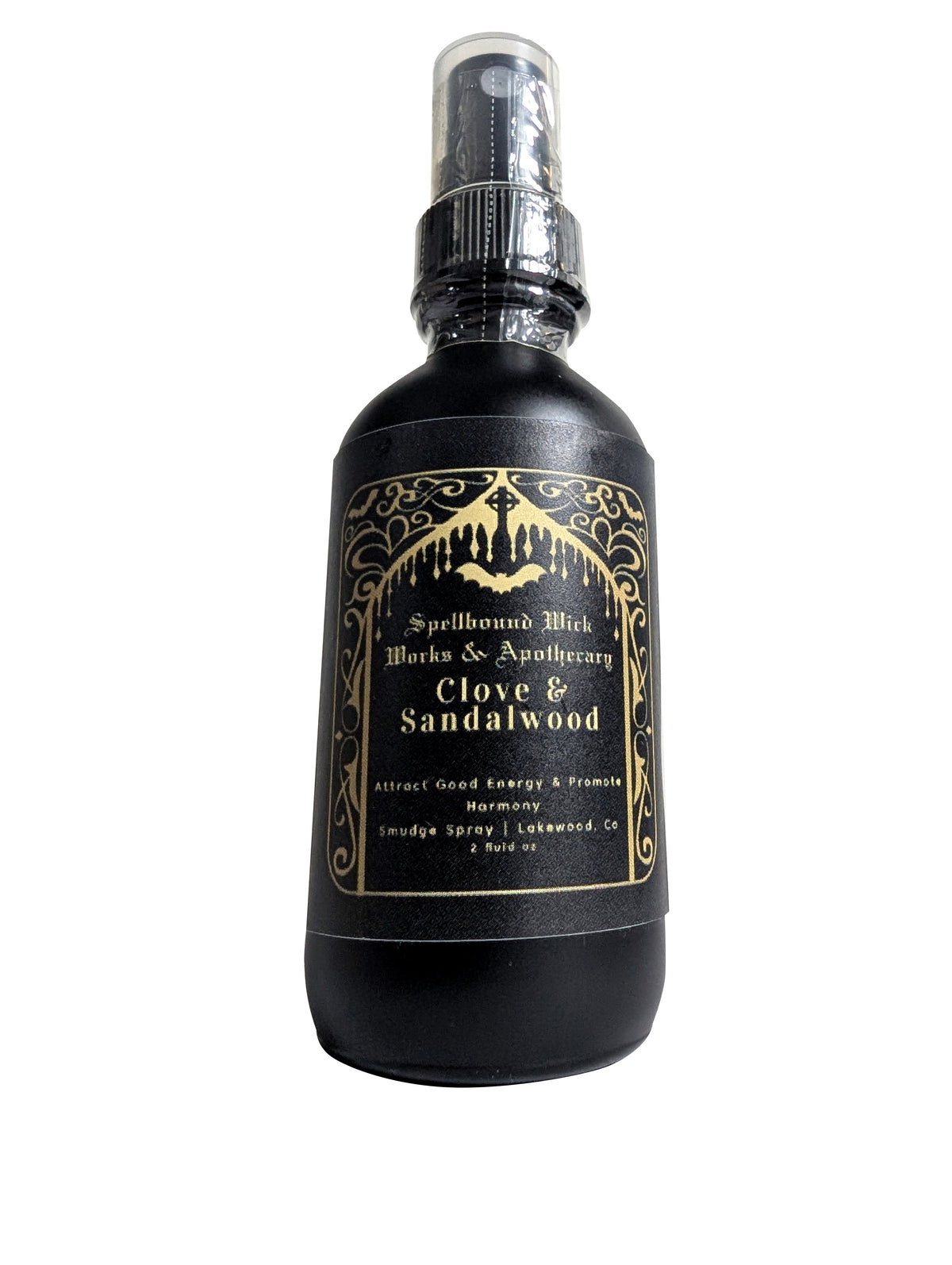 Front view of the matte black spray bottle with its clear plastic spray top and gold foil label.