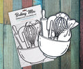 Two Baking Mix interactive coloring kits in their packaging on a painted wood background, showing the uncolored mixing bowl, whisk and rolling pin cutouts behind the Baking Mix header card.