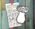 Back of two Flower Bundle kits on a painted wood background, showing the how to instructions and the double sided art board covered in flower line drawings.