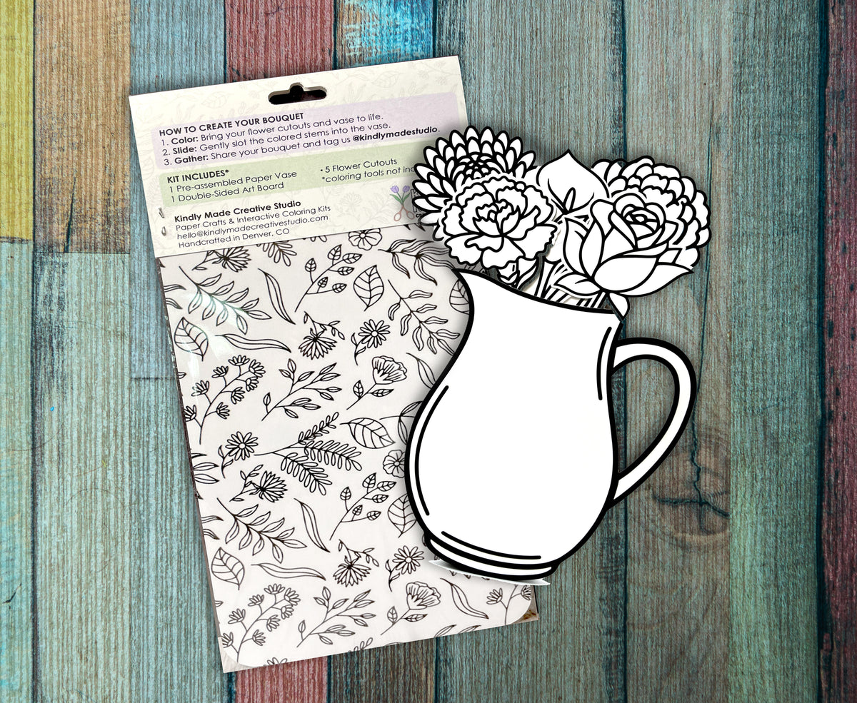 Back of two Flower Bundle kits on a painted wood background, showing the how to instructions and the double sided art board covered in flower line drawings.