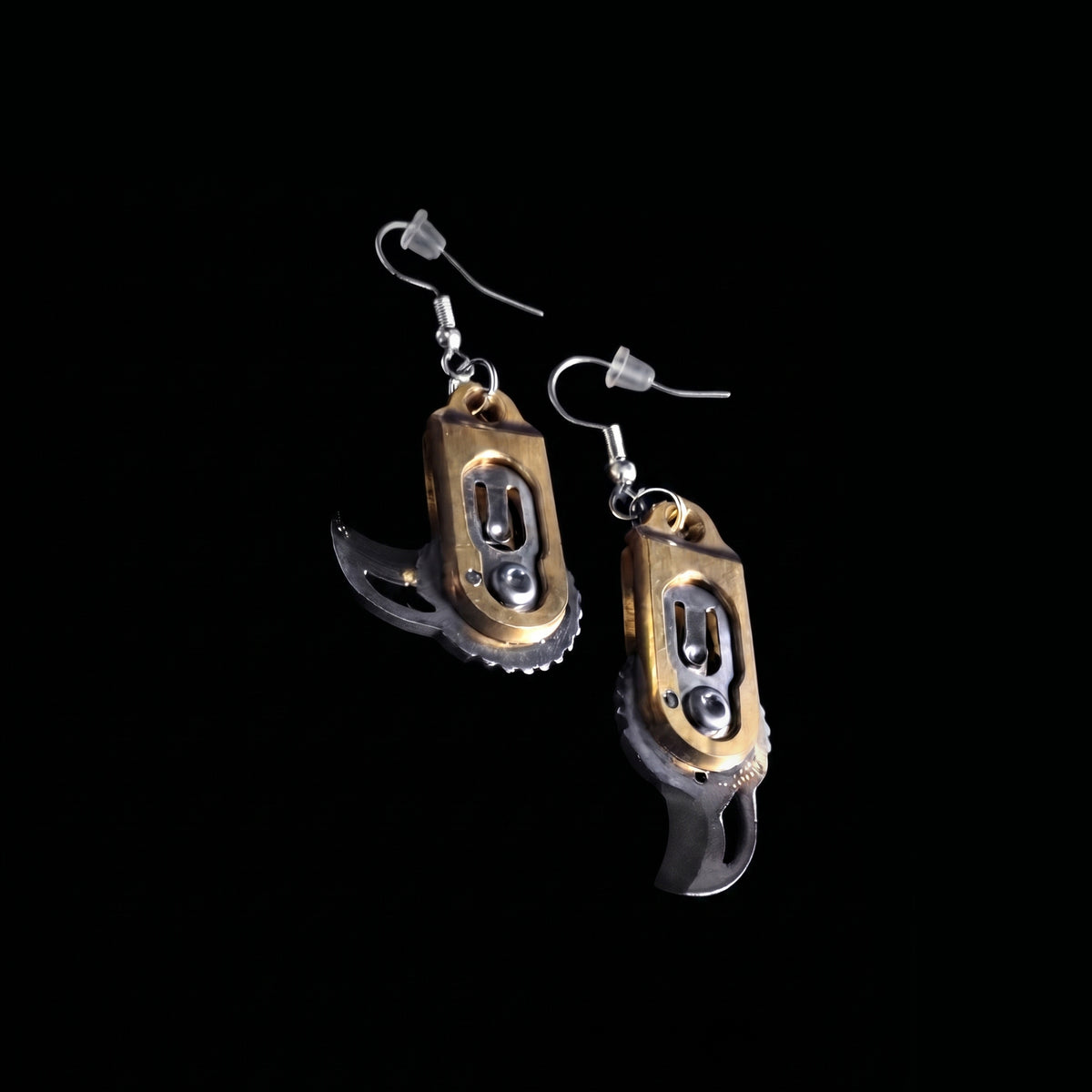 Gear pocket knife earrings by Pocket & Bear Collective on a black background with both stainless steel blades swung open