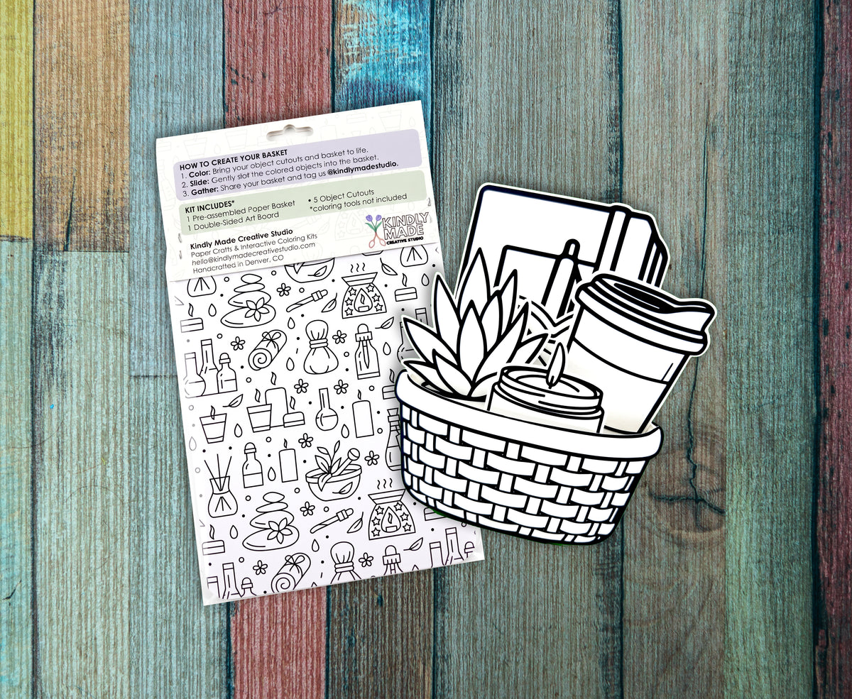 Back of two Self Care kits on painted wood, showing the how to instructions and the double sided art board covered in self care line drawings.