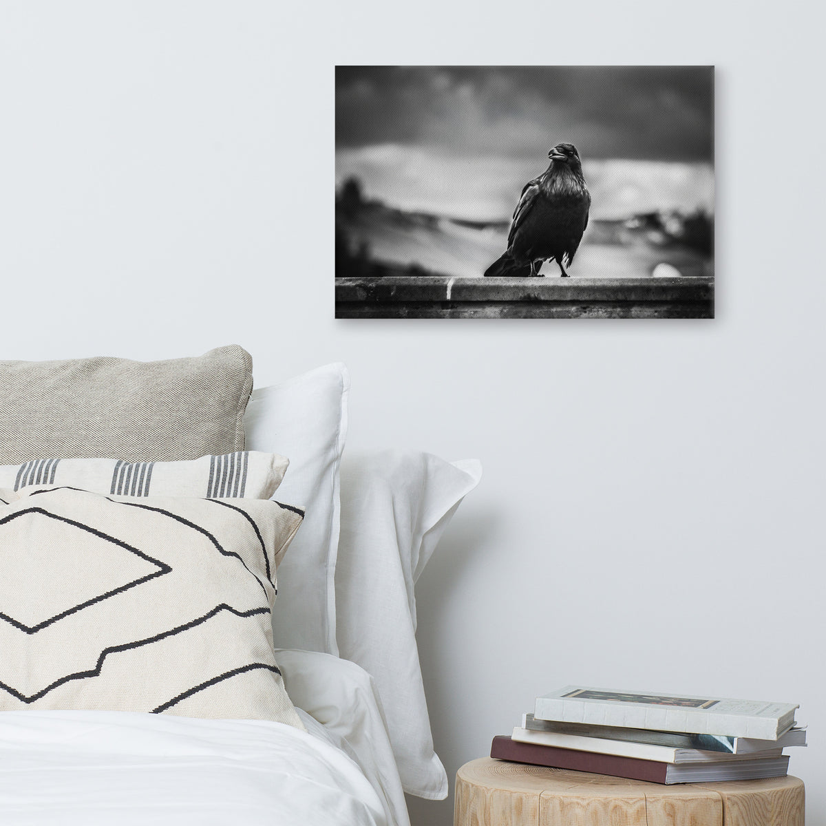 Crow So Chic canvas print by Iain Camacho, large horizontal canvas hanging above a bed with white and patterned pillows