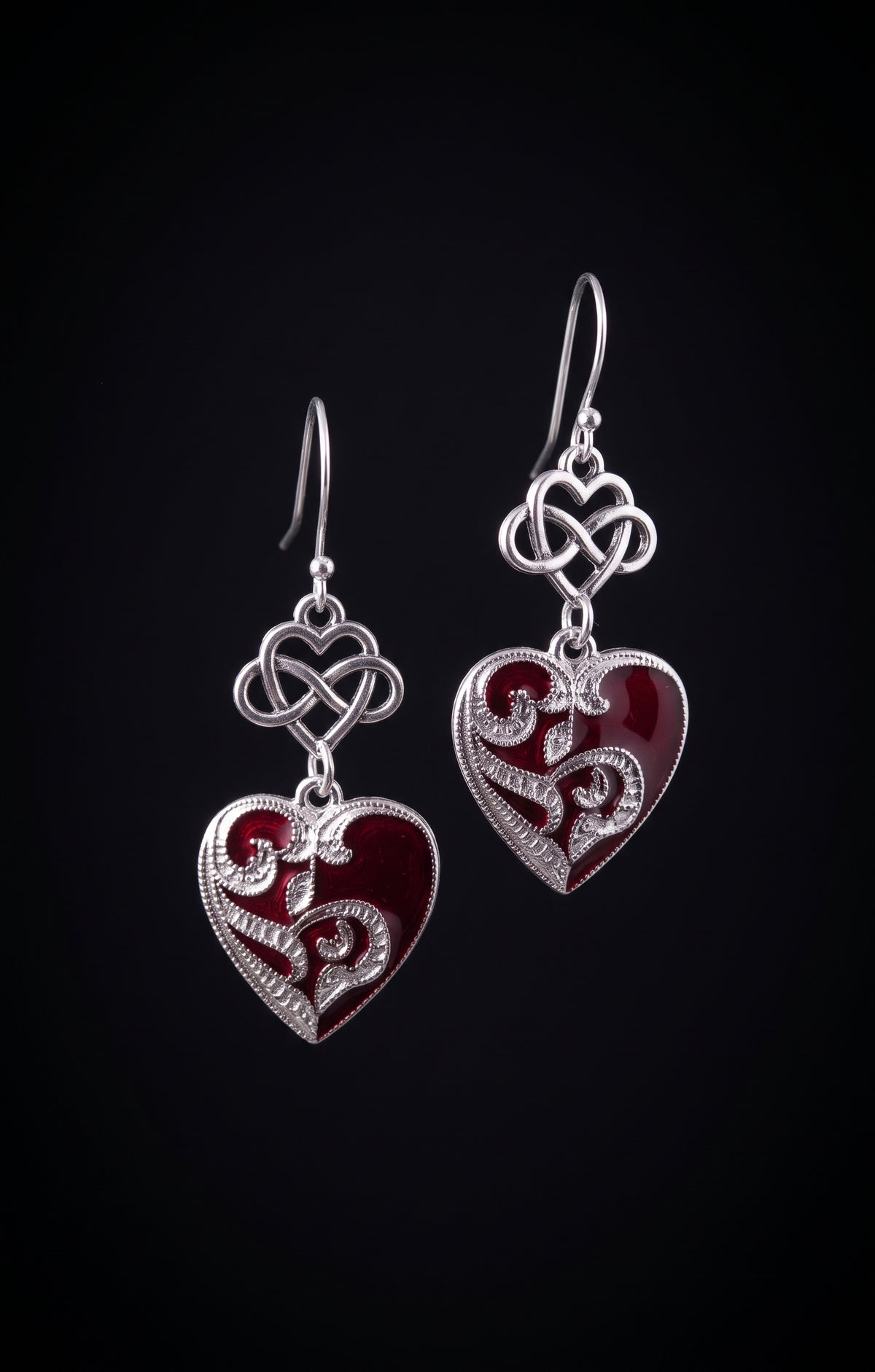 Infinity Hearts Earrings by Circle of Heather, silver-tone dangle earrings with an infinity heart knot above a filigree heart in deep red enamel