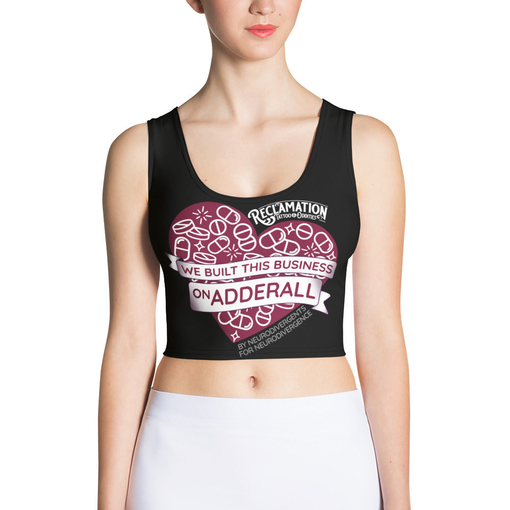 We Built This Business On Adderall crop top worn by a model, close front view of the pill-filled heart with by neurodivergents for neurodivergents beneath the banner