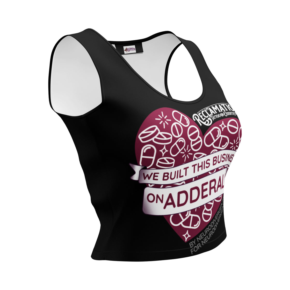 We Built This Business On Adderall crop top, front view, showing a dark red heart filled with white outlined pills, capsules and sparkles, two white ribbon banners across it reading we built this business on Adderall, the Reclamation Tattoo & Oddities logo above, and by neurodivergents for neurodivergents below