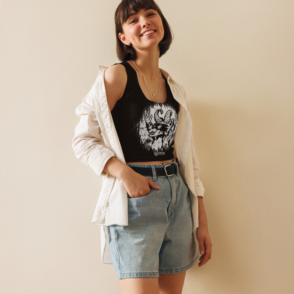 Cornelius Baphomet crop top in black, angled front view showing Cornelius the horned raccoon and the body-hugging fit