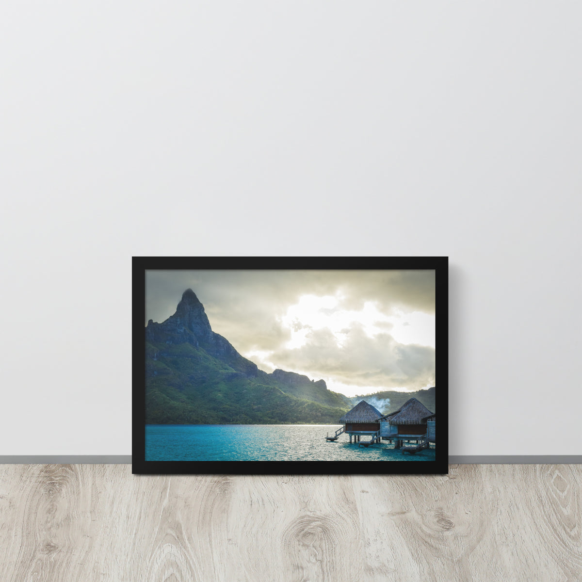 Bora Bora, French Polynesia framed luster print by iain, black framed print resting on a light wood floor against a white wall