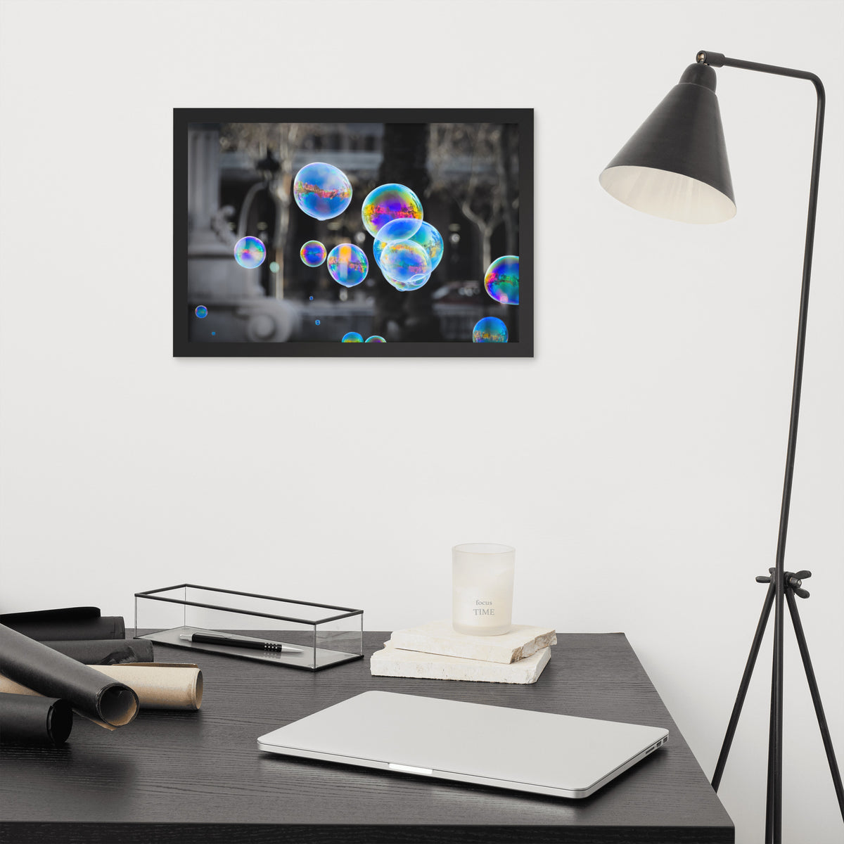 Bubbles of Barcelona framed luster print by iain, black framed print hanging above a desk next to a black floor lamp