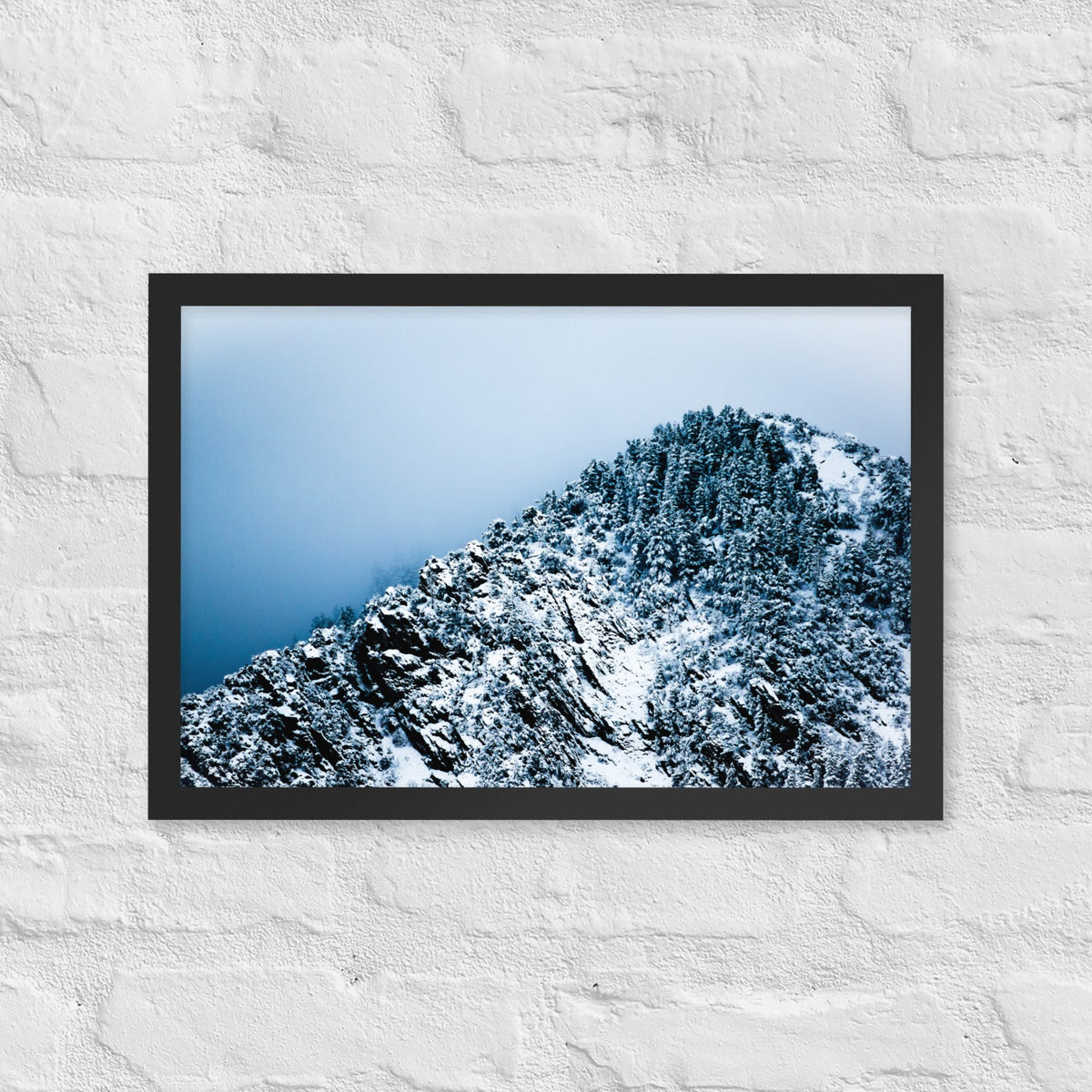 Colorado Mountain framed luster print by iain, black framed print hanging on a white brick wall