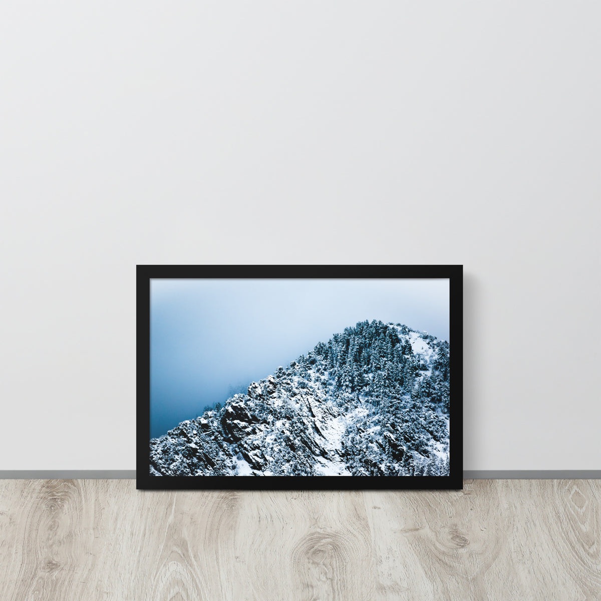 Colorado Mountain framed luster print by iain, black framed print resting on a light wood floor against a white wall