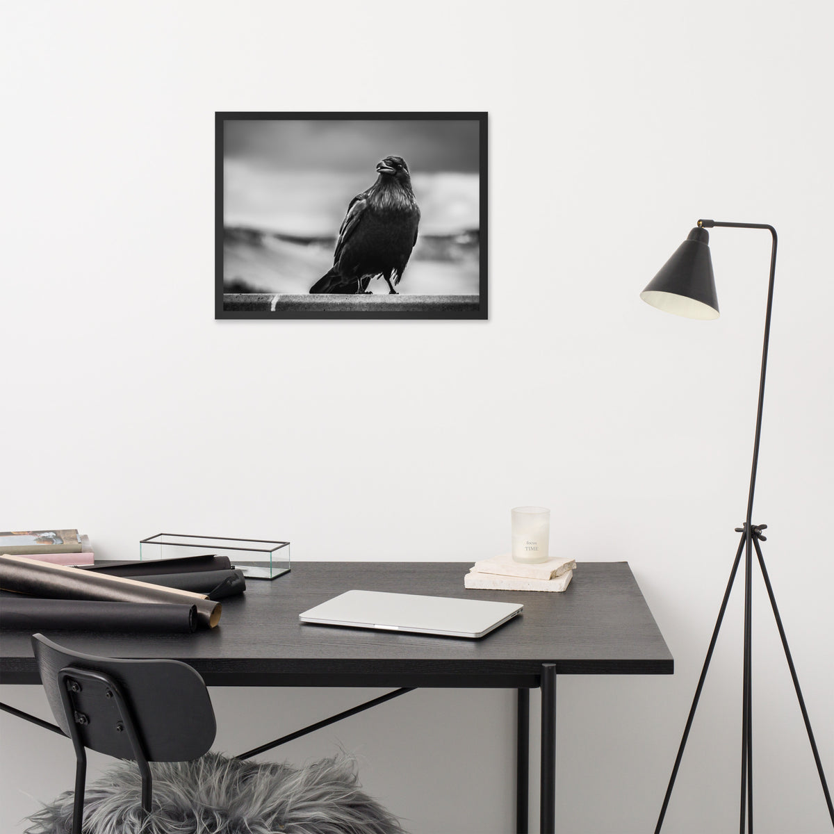 Crow So Chic framed luster print by iain, smaller black framed print hanging above a desk next to a black floor lamp