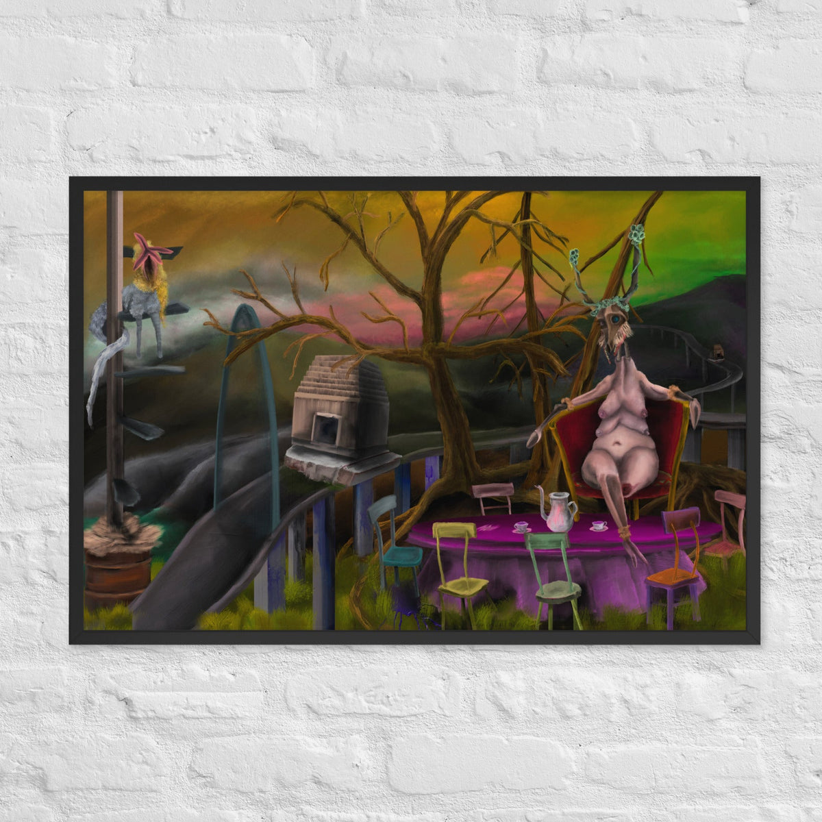 Deer Dra’s Picnic by Fish, framed luster print of a pale seated figure at a purple picnic table under bare trees with a deer-like figure nearby, hanging on a white brick wall