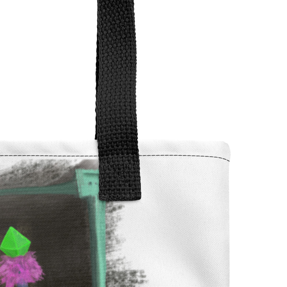 Close view of the black cotton denim handles and top edge of The Sitting Room Framed Daemon tote bag by Fis