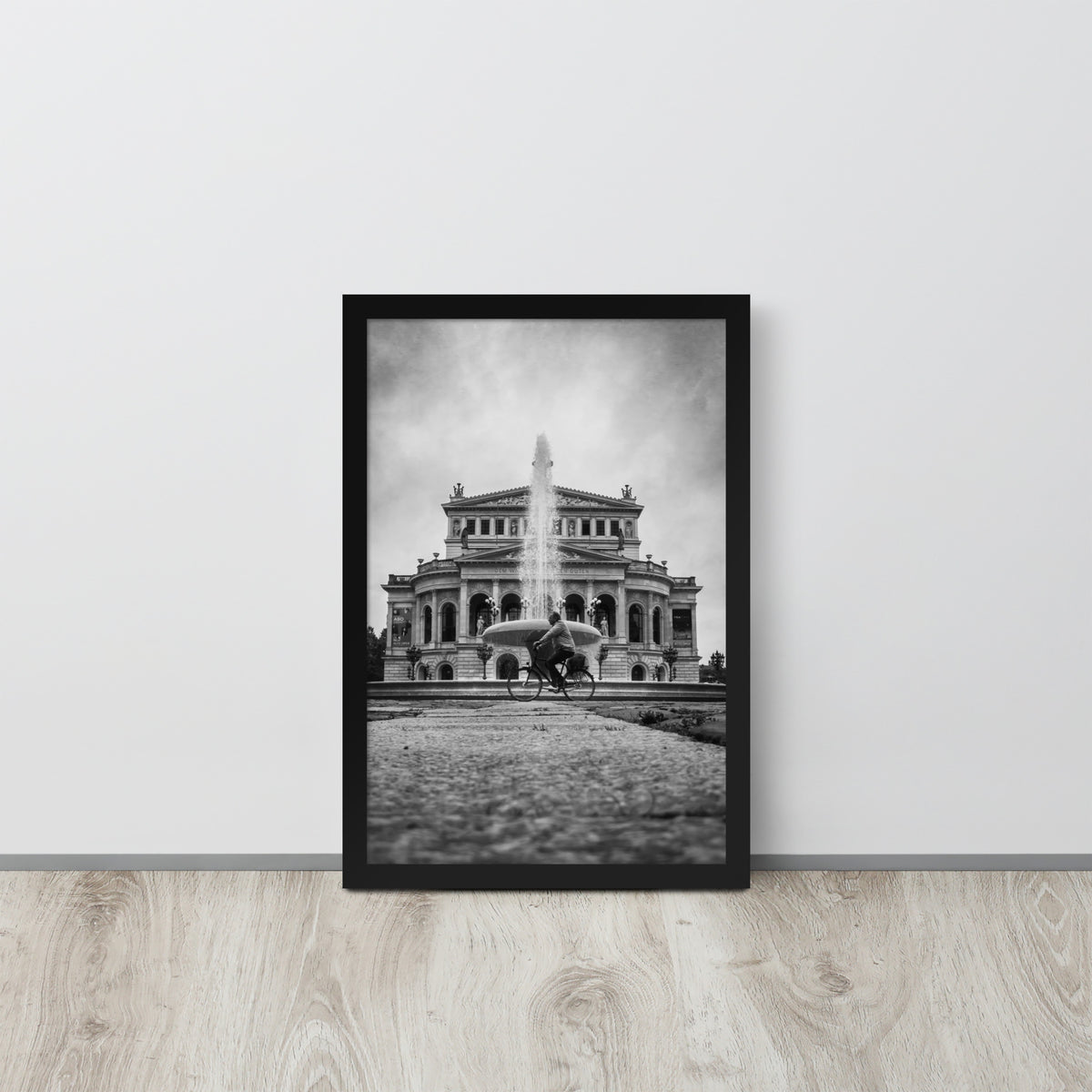 German Precision framed luster print by iain, black framed print resting on a light wood floor against a white wall