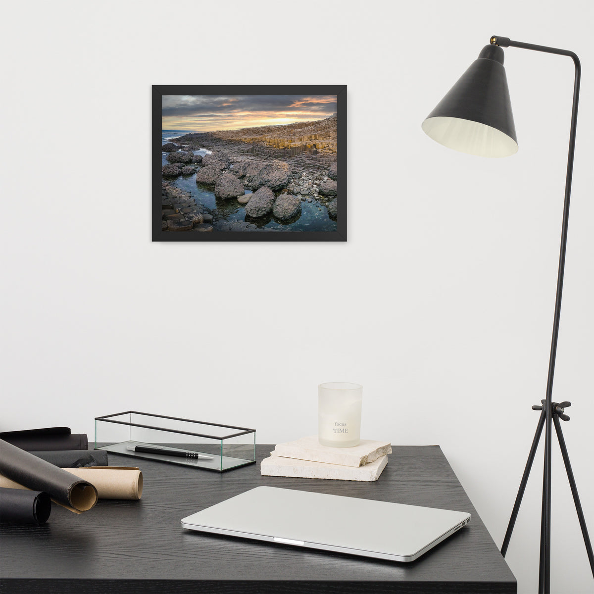 Giant's Causeway, Northern Ireland framed luster print by iain, smaller black framed print hanging above a desk next to a black floor lamp
