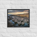 Giant's Causeway, Northern Ireland framed luster print by iain, larger black framed print hanging on a white brick wall