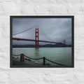 Golden Gate Bridge, San Francisco framed luster print by iain, black framed photograph of the red bridge fading into low fog over gray water, hanging on a white brick wall