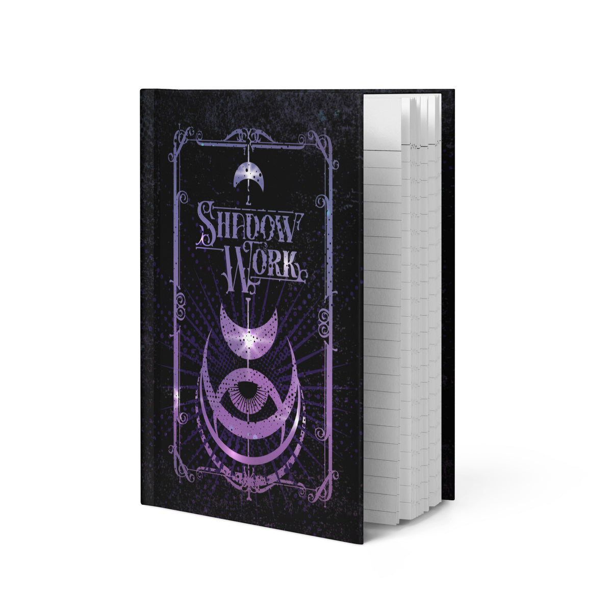 Shadow Work journal standing open at an angle, showing the purple moon and eye cover design alongside the lined white pages inside