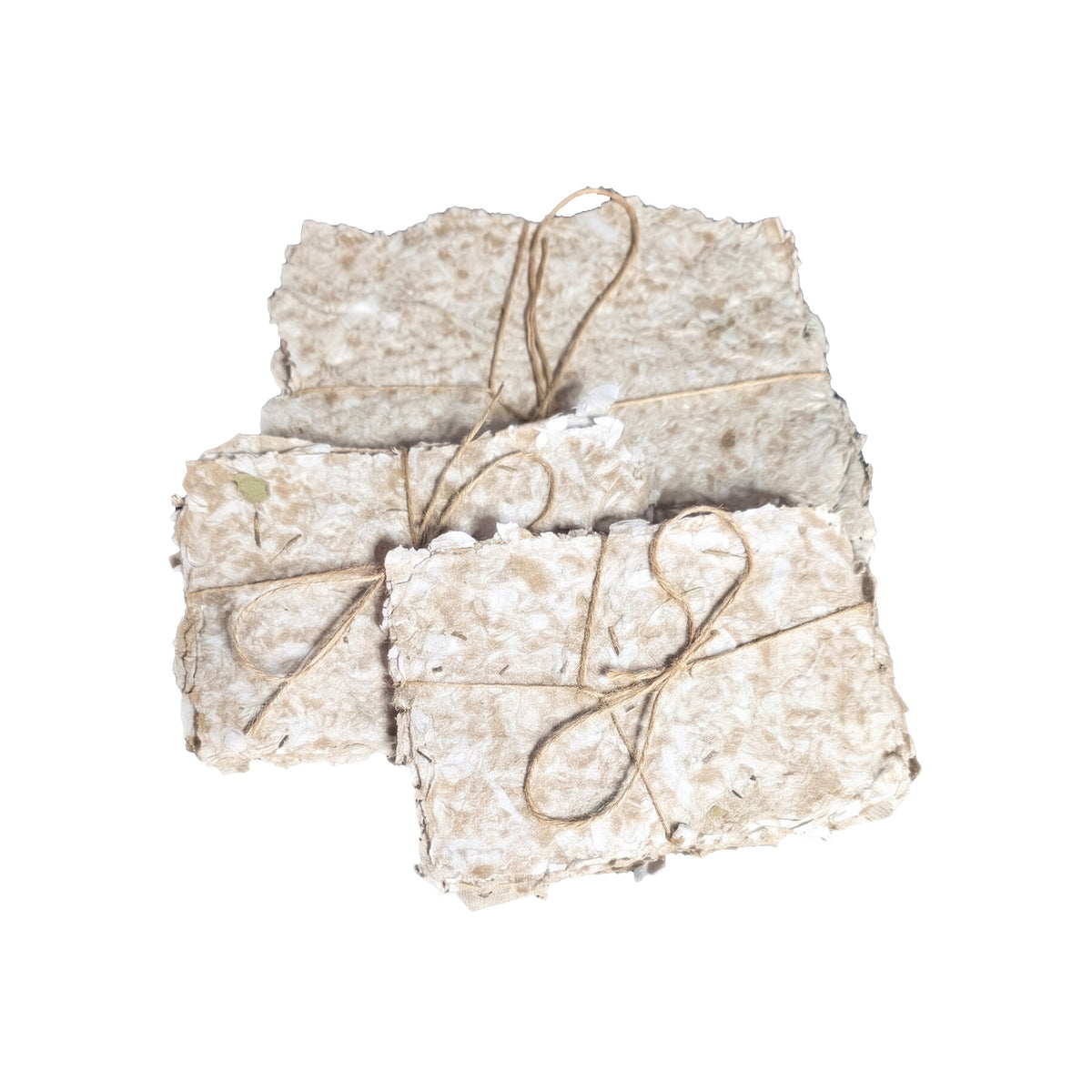 Three bundles of handmade paper tied with twine arranged together on a white background, showing both the small and large sheet sizes