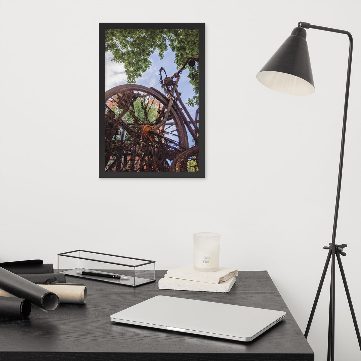 Rusty Bicycle framed luster print by iain, black framed print hanging above a desk next to a black floor lamp