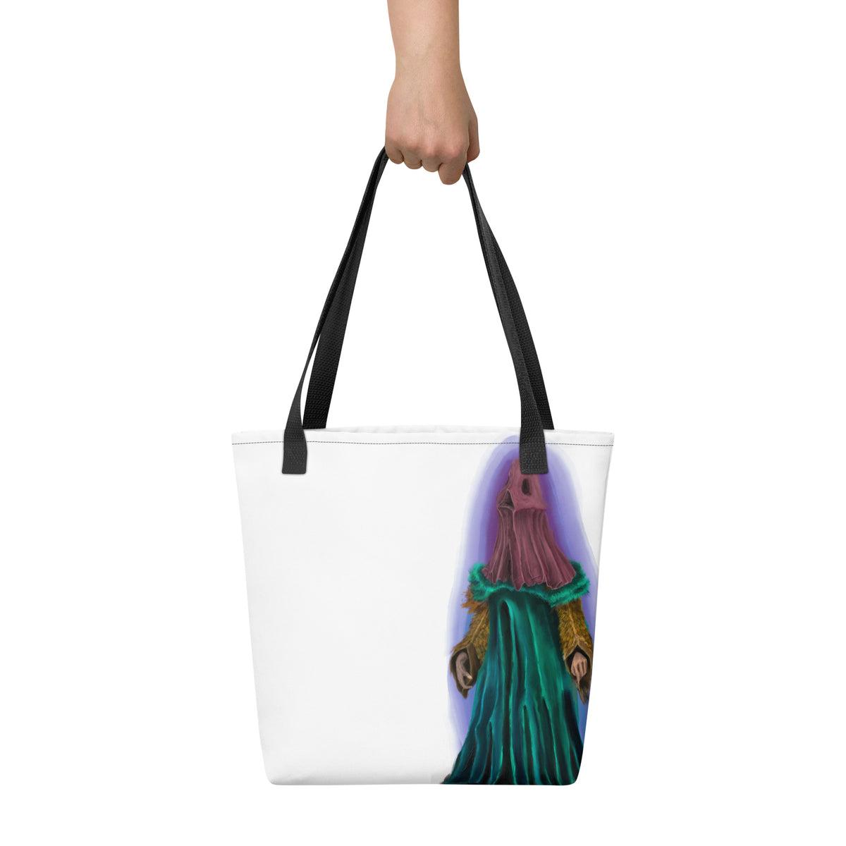 White tote bag held up by a hand against a neutral background, displaying the scale and vertical placement of the front graphic.