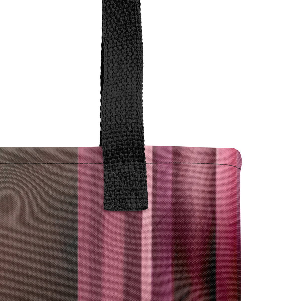 Detailed close-up shot focusing on the textured vertical stripes and abstract patterns of the bag print.