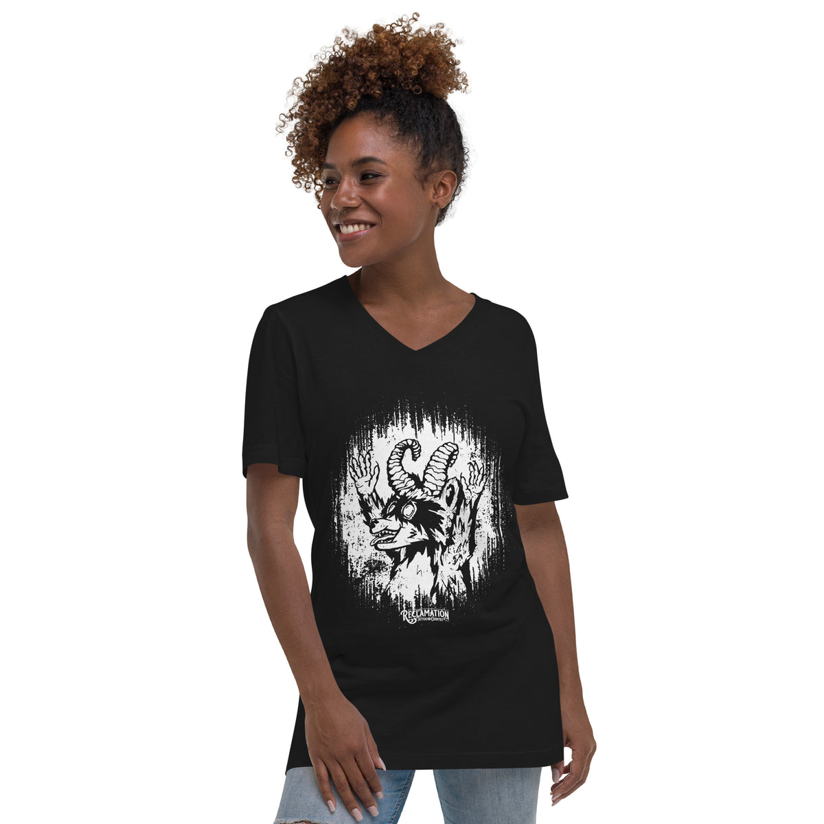 Model wearing the Cornelius Baphomet v-neck tee in black with jeans, front view, showing the horned raccoon print across the chest