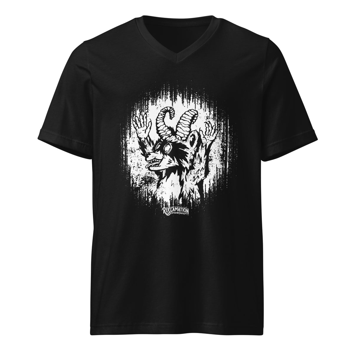 Cornelius Baphomet v-neck tee in black, front view laid flat, with Cornelius the horned raccoon in white line work inside a ragged halo and the Reclamation Tattoo & Oddities banner beneath