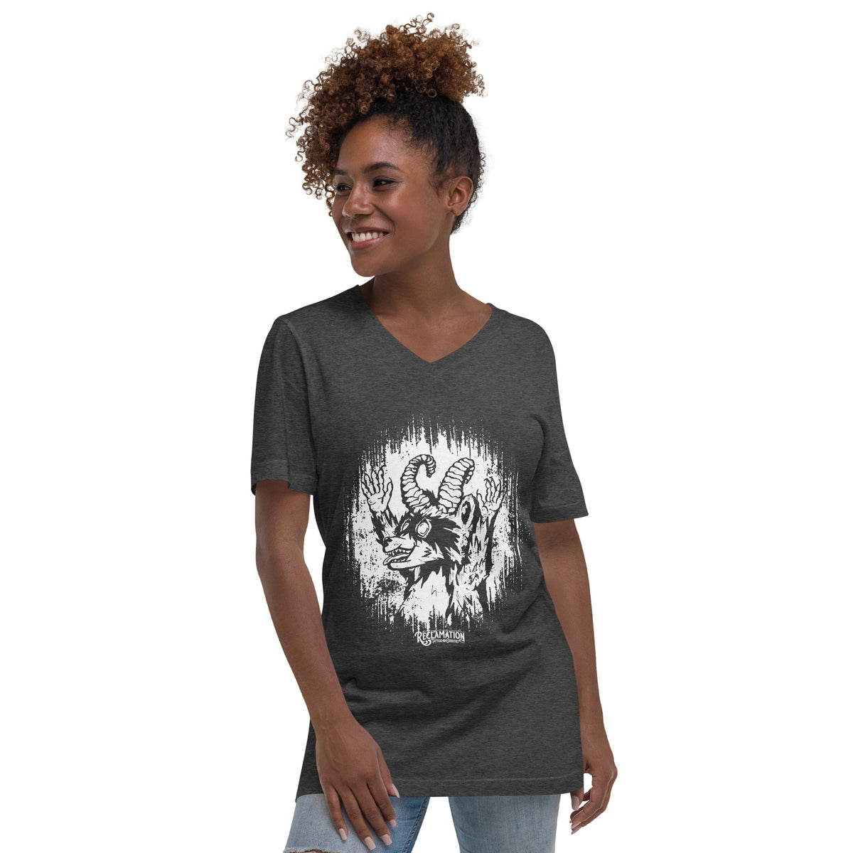 Model wearing the Cornelius Baphomet v-neck tee in dark grey heather with jeans, front view, showing the horned raccoon print across the chest