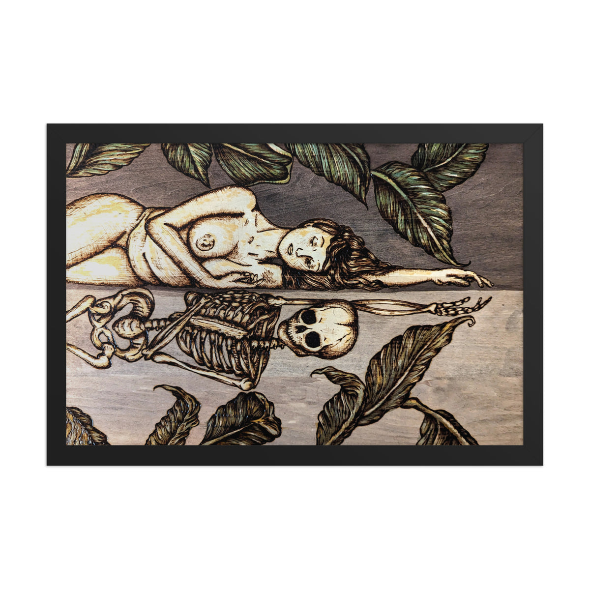 Vainglorious Contrition framed luster print by Cami Thunder, front view of the black framed print showing the wood grain, burned linework, and the woman mirrored by the skeleton below her